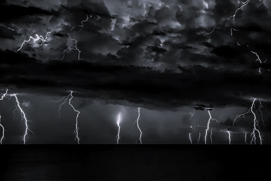 MAN WALKS OUT ON STAGE AS STORM ROLLS IN